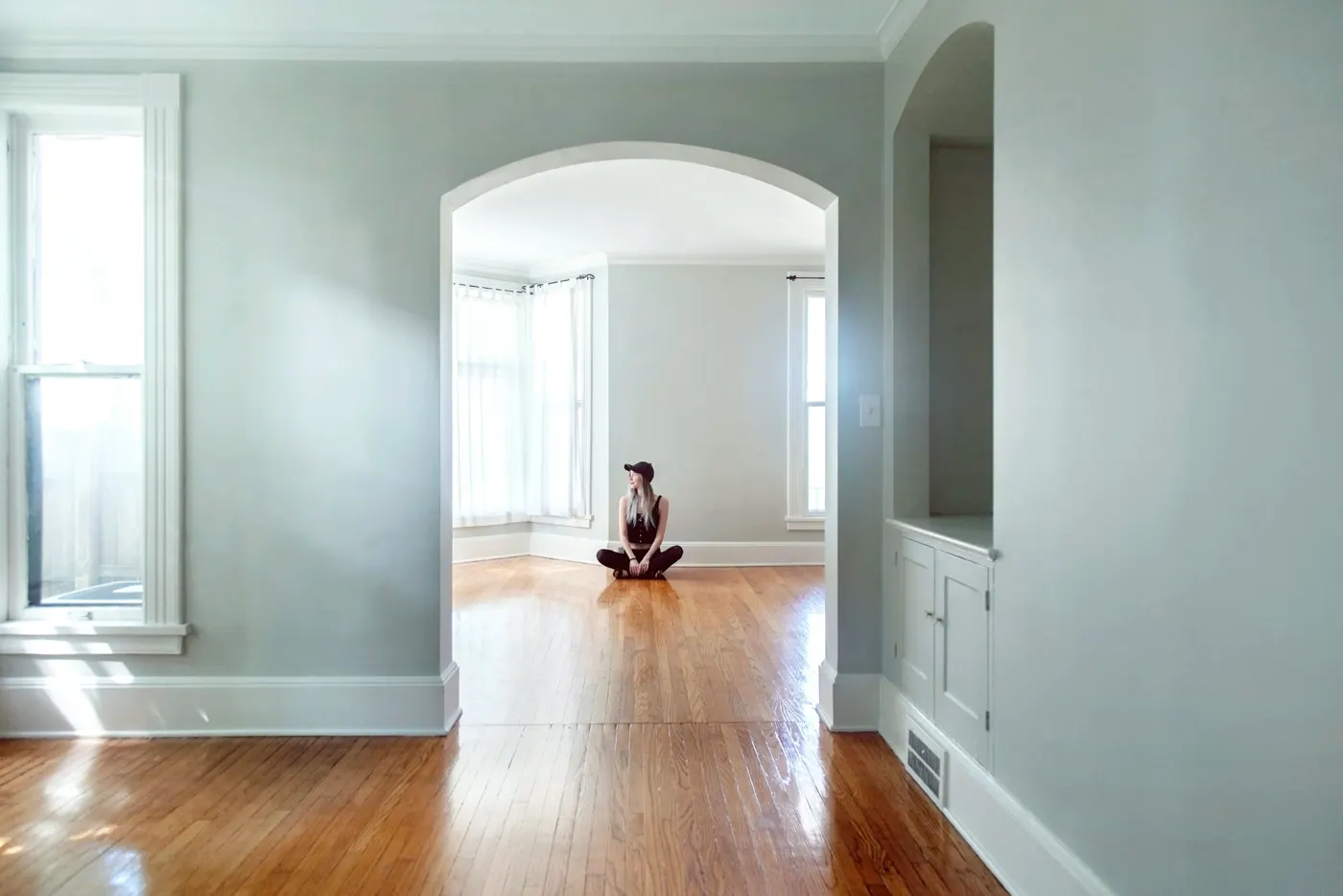 An empty, freshly bought house with sunlit wooden floors
